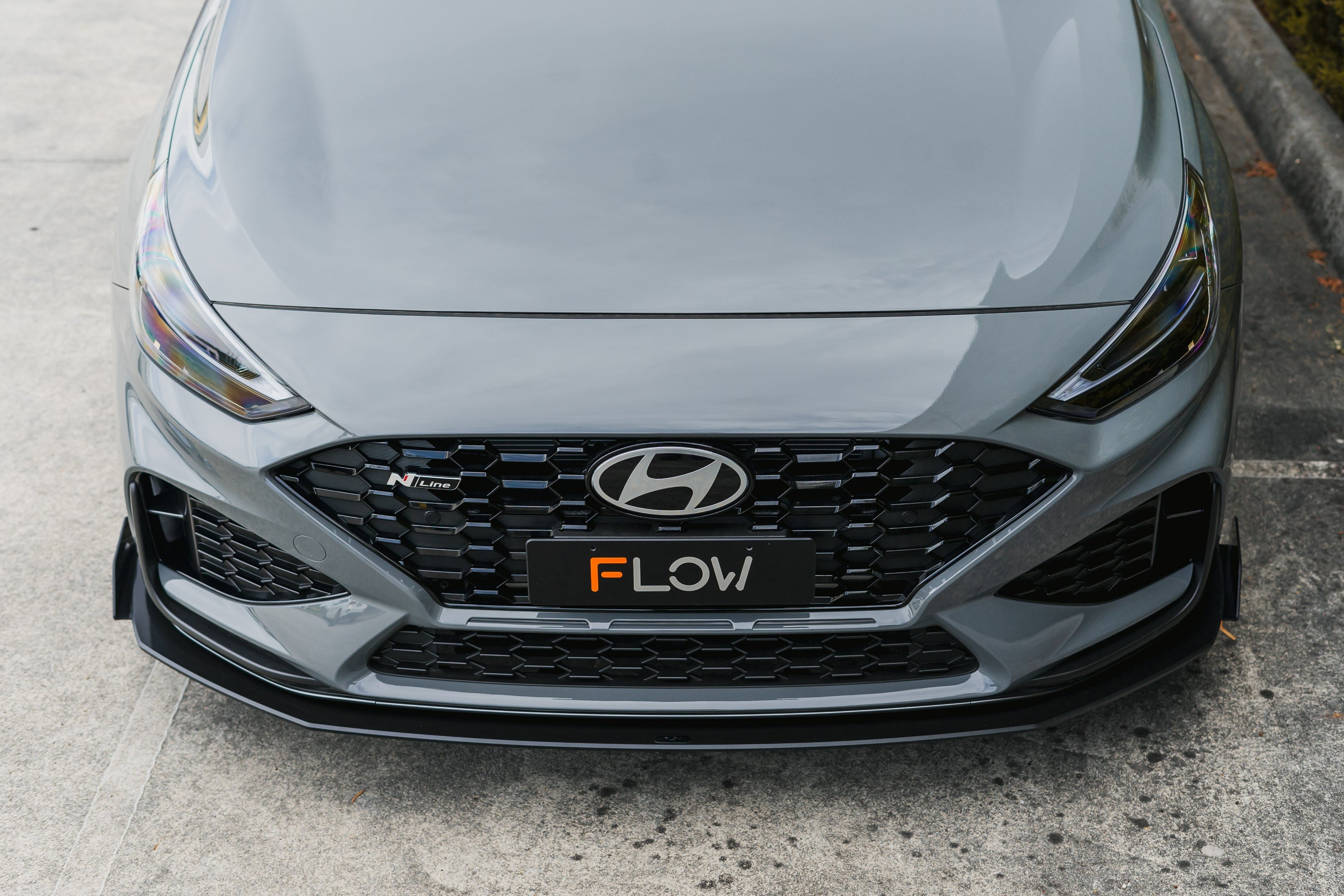 FLOW Designs  i30N-Line Hatch PDe.V6 FL 2024+ Front Lip Splitter & Reinforcement Brackets - MODE Auto Concepts
