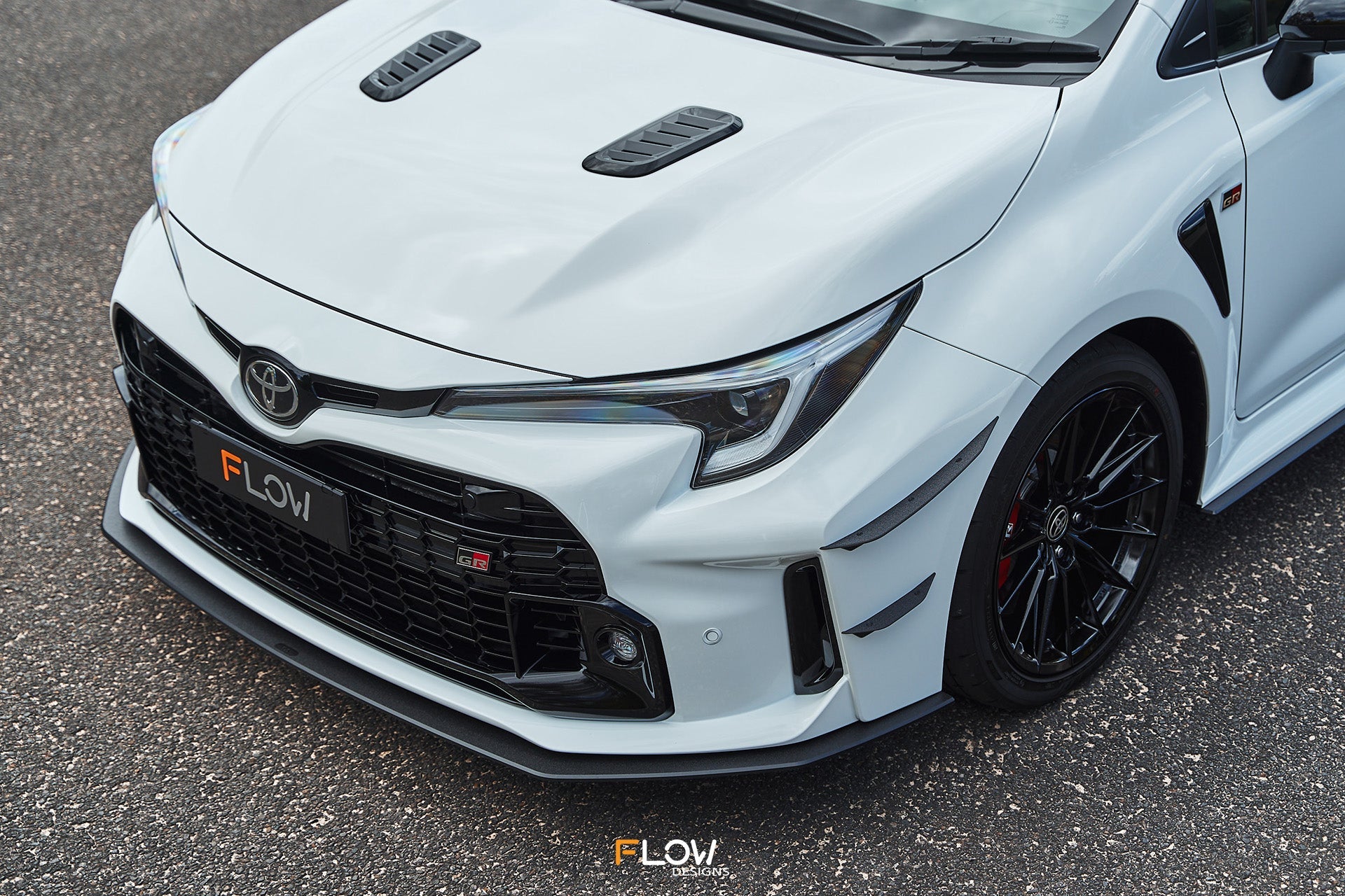 FLOW Designs  Corolla GR Chassis Mounted Front Lip Splitter (TEXTURED) - MODE Auto Concepts
